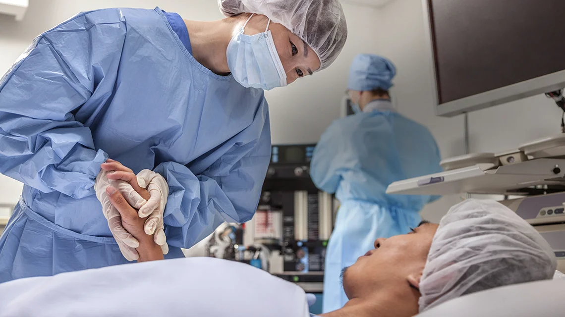 a surgeon speaking to a patient