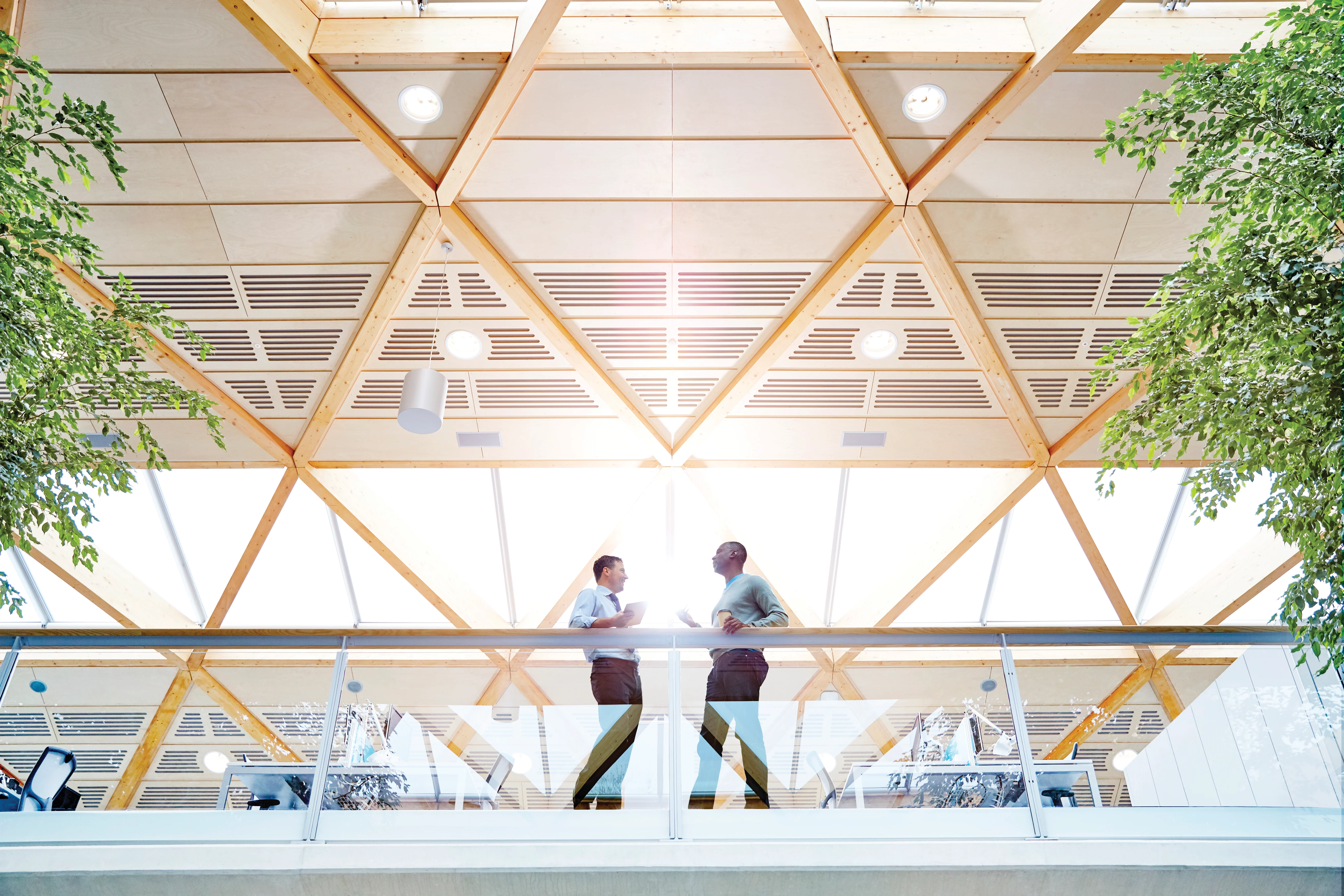 a couple of people walking on a roof
